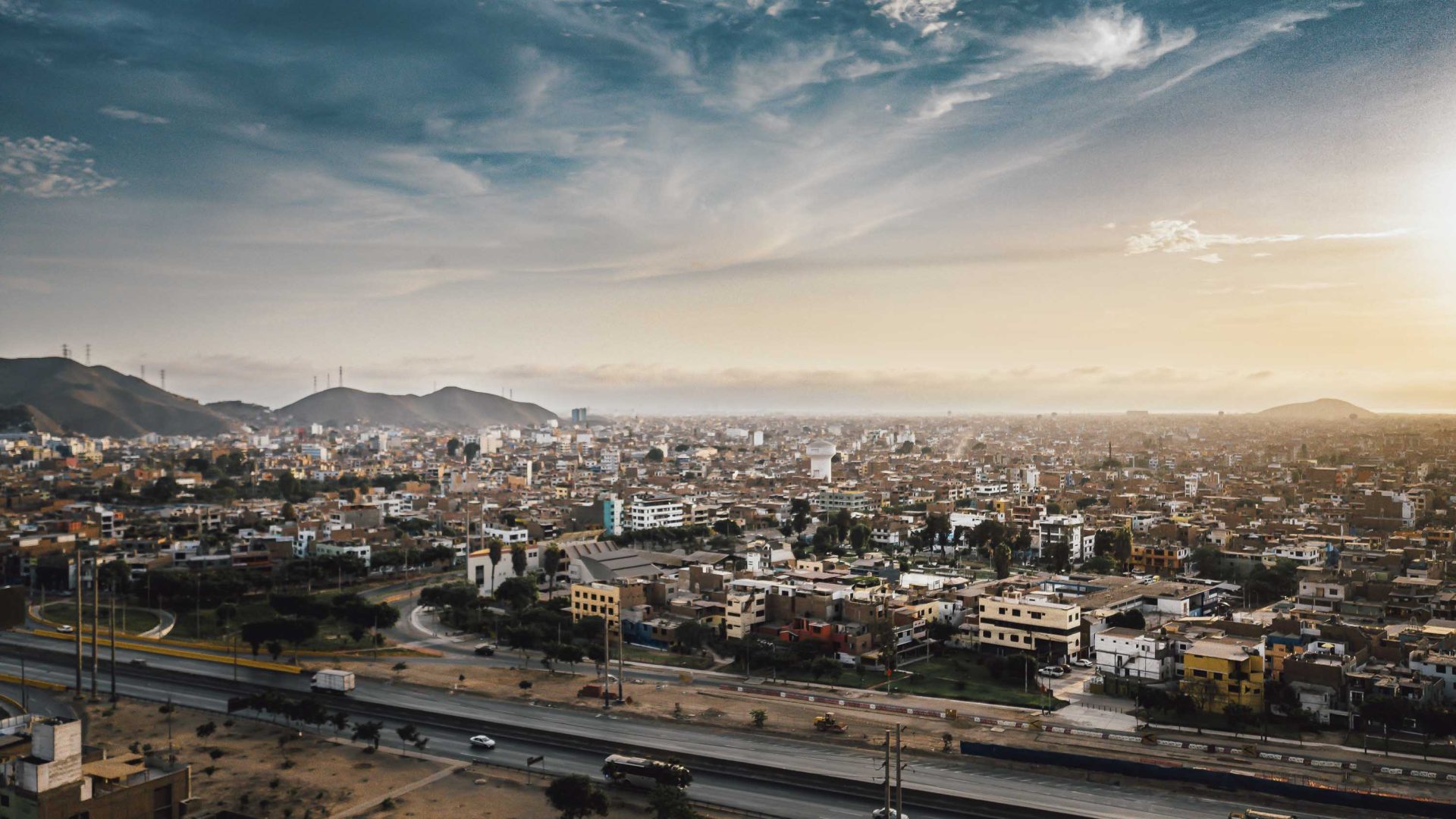 The buildings with the water in the background of Lima, Peru.